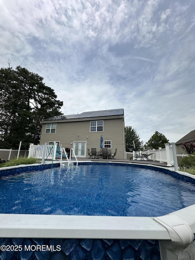 view of swimming pool with a fenced in pool and fence