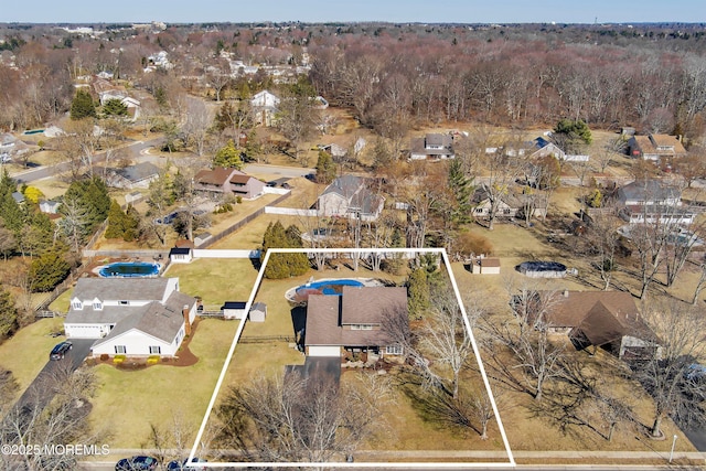 birds eye view of property with a residential view