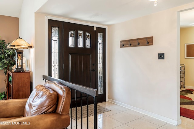 foyer entrance with light tile patterned floors, visible vents, and baseboards