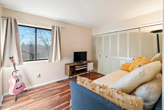 living area featuring wood finished floors and baseboards