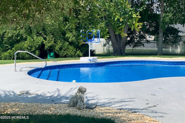 view of swimming pool with a fenced in pool and fence