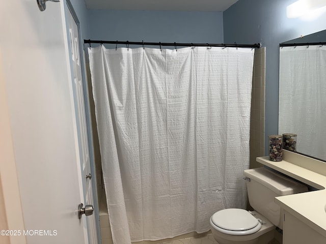 bathroom featuring vanity, toilet, and shower / bathtub combination with curtain