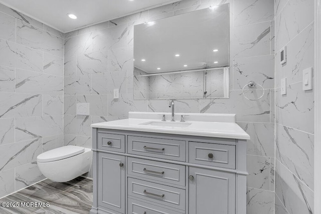 136 Van Brackle Rd, Matawan, NJ 07747 - full bathroom featuring tile walls, vanity, toilet, and marble finish flooring