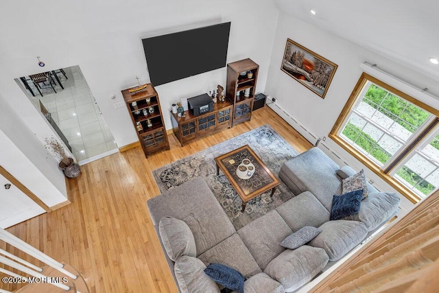 136 Van Brackle Rd, Matawan, NJ 07747 - living room with a baseboard heating unit, wood finished floors, baseboards, and recessed lighting