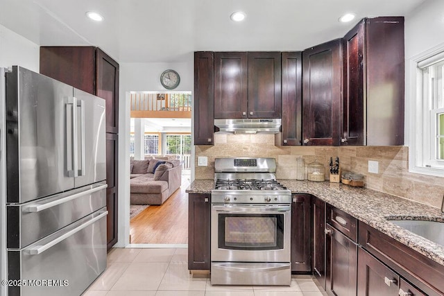 136 Van Brackle Rd, Matawan, NJ 07747 - kitchen with appliances with stainless steel finishes, range hood, light stone counters, dark brown cabinetry, and recessed lighting