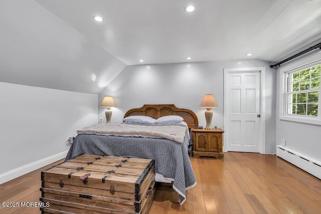 136 Van Brackle Rd, Matawan, NJ 07747 - bedroom featuring a baseboard radiator, wood finished floors, vaulted ceiling, recessed lighting, and baseboards