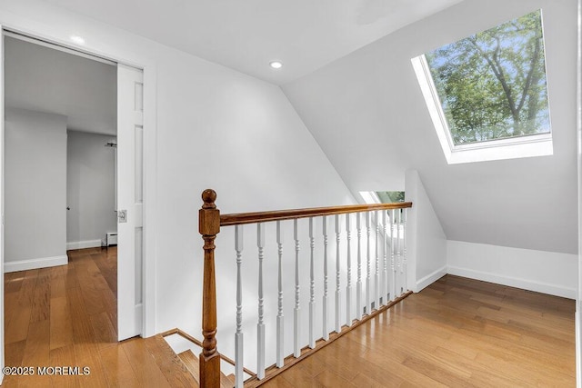 136 Van Brackle Rd, Matawan, NJ 07747 - staircase with a skylight, baseboards, wood finished floors, recessed lighting, and a baseboard radiator