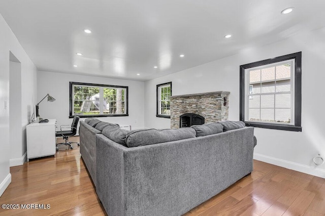136 Van Brackle Rd, Matawan, NJ 07747 - living area with wood finished floors, a stone fireplace, recessed lighting, baseboards, and an office area