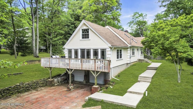 136 Van Brackle Rd, Matawan, NJ 07747 - rear view of property featuring stucco siding, a wooden deck, a yard, an attached garage, and roof with shingles