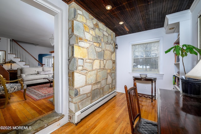 hall with arched walkways, wooden ceiling, a baseboard radiator, wood finished floors, and crown molding