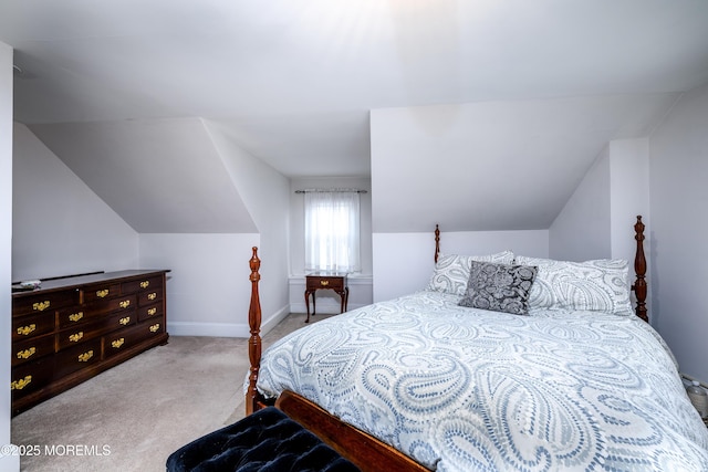 bedroom featuring baseboards, vaulted ceiling, and carpet flooring