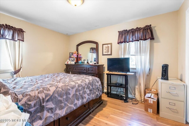 bedroom featuring light wood-style flooring