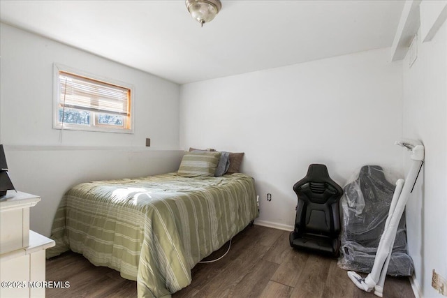 bedroom featuring wood finished floors