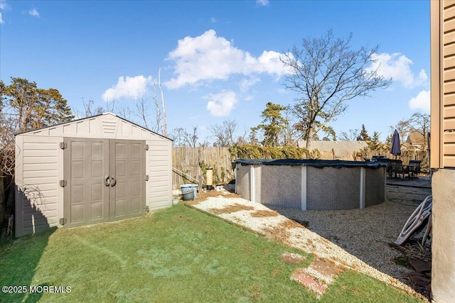 view of shed featuring a covered pool and fence