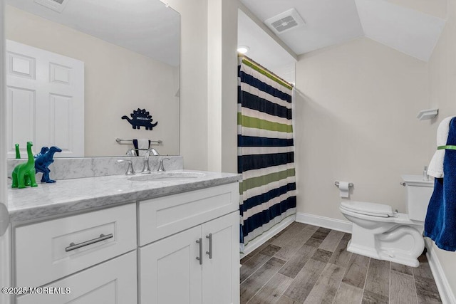 full bath featuring toilet, wood finished floors, visible vents, vanity, and vaulted ceiling