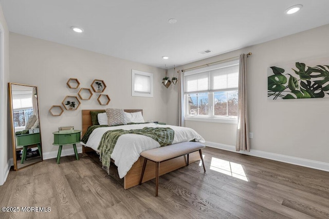 bedroom featuring recessed lighting, wood finished floors, and baseboards