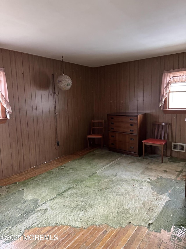 interior space with wood walls and visible vents