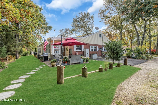 exterior space with a yard and driveway