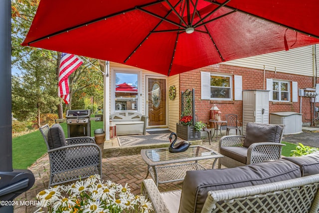 view of patio / terrace featuring an outdoor hangout area and grilling area