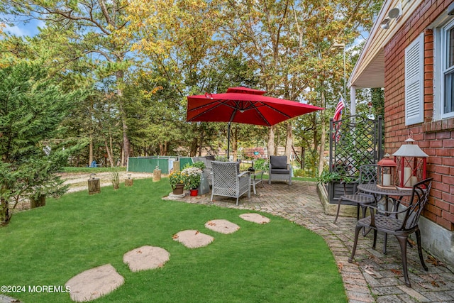 view of yard featuring a patio area and fence