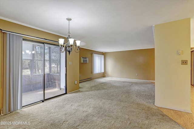 empty room featuring a baseboard radiator, an inviting chandelier, ornamental molding, a wall mounted AC, and carpet flooring