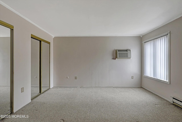 unfurnished room with a wall mounted AC, a baseboard radiator, carpet flooring, and crown molding