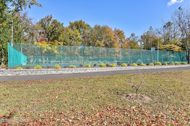 exterior space with fence and a yard