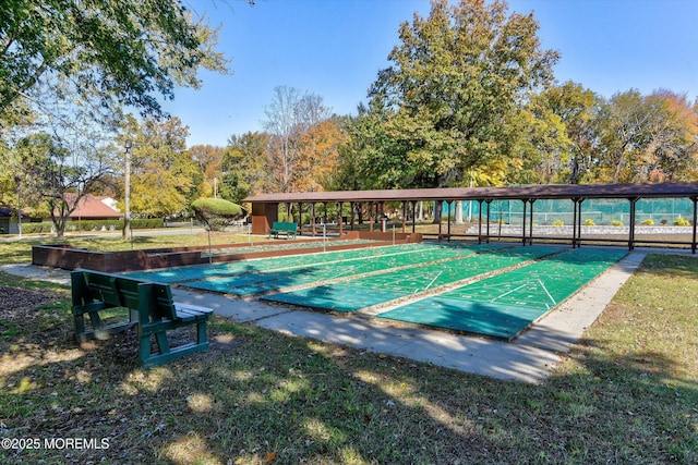 view of home's community featuring shuffleboard