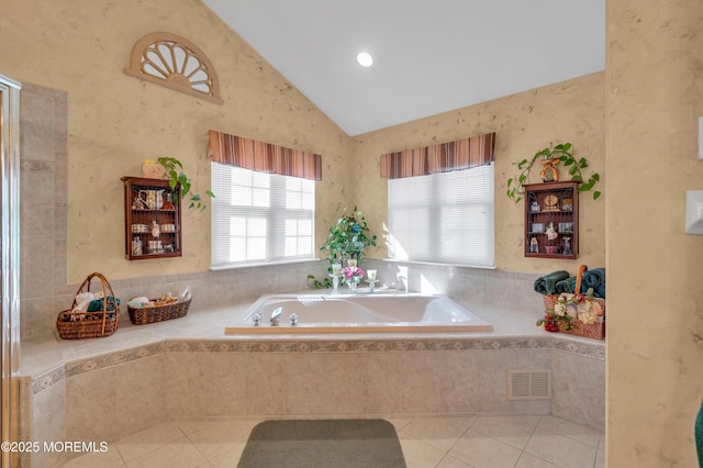 full bath with tile patterned flooring, visible vents, vaulted ceiling, and a bath