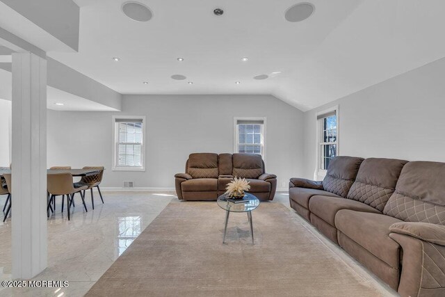 living room with lofted ceiling, recessed lighting, baseboards, and marble finish floor