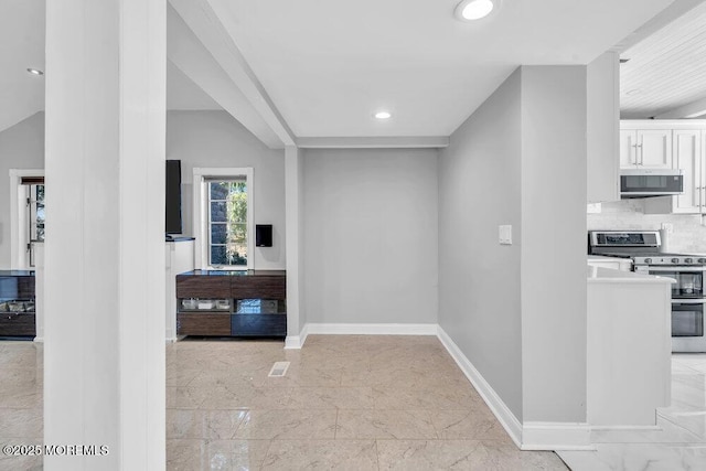 interior space featuring recessed lighting, baseboards, and marble finish floor