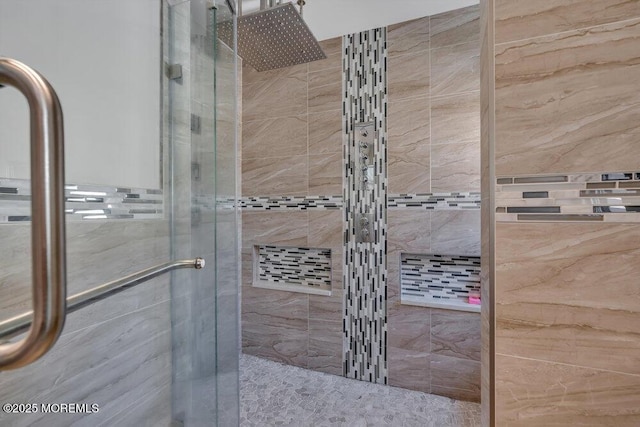 bathroom with a shower stall