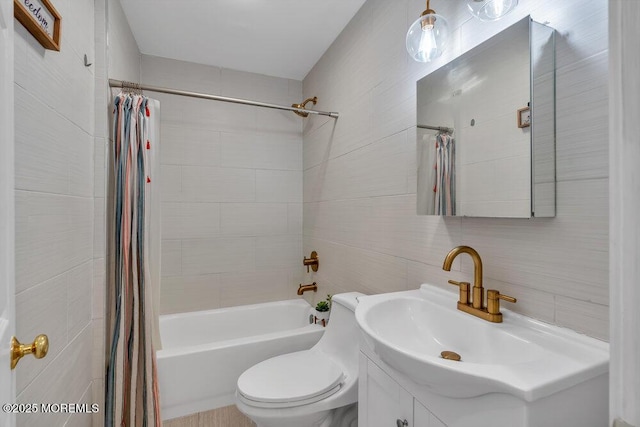 full bathroom featuring vanity, tile walls, shower / tub combo, and toilet