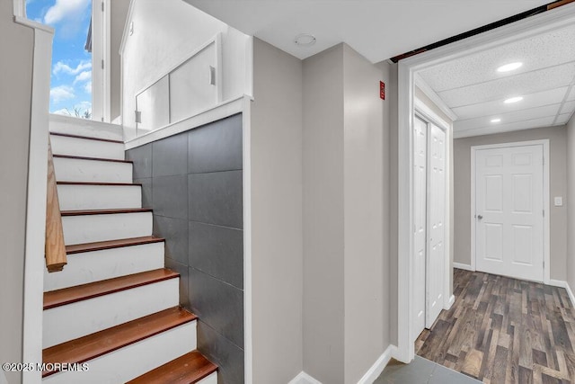 stairs with recessed lighting, baseboards, and wood finished floors