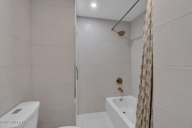 bathroom with shower / tub combo with curtain, toilet, and tile walls