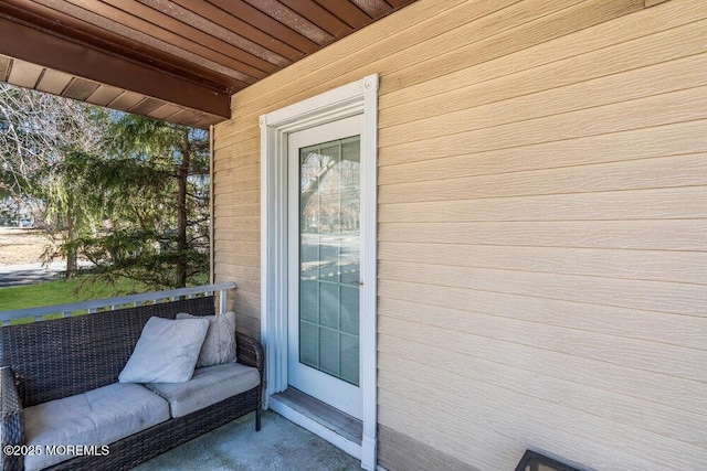 entrance to property with a balcony