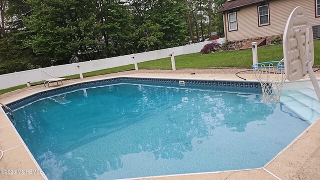 view of pool featuring a fenced in pool, a lawn, and a fenced backyard