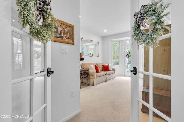 interior space with french doors, carpet flooring, and recessed lighting