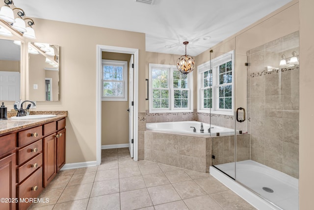 full bathroom featuring visible vents, vanity, a bath, tile patterned floors, and a stall shower