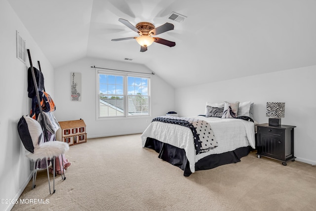 bedroom featuring vaulted ceiling, carpet flooring, and visible vents