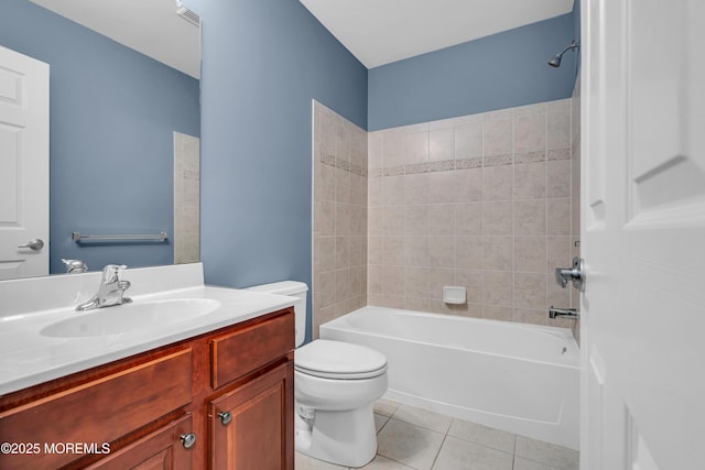 full bathroom with bathtub / shower combination, visible vents, toilet, vanity, and tile patterned flooring