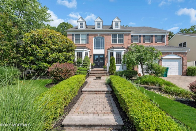 7 Trumbull Ct, Jackson, NJ 08527 - colonial house featuring brick siding, a garage, french doors, and driveway