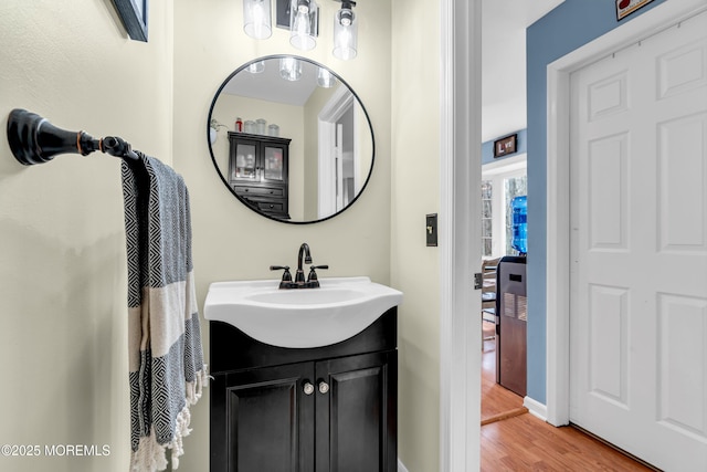 bathroom with vanity and wood finished floors