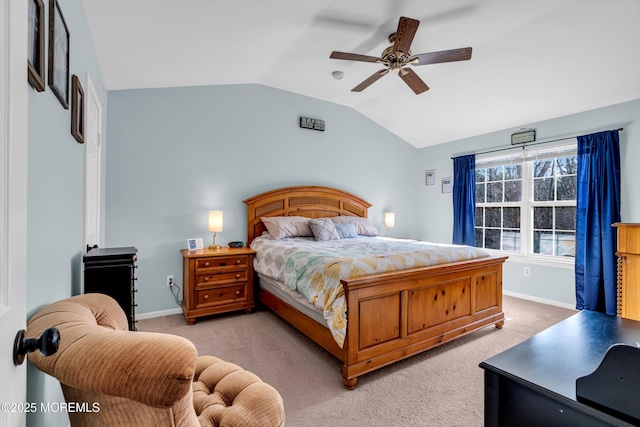 bedroom featuring lofted ceiling, light carpet, baseboards, and a ceiling fan