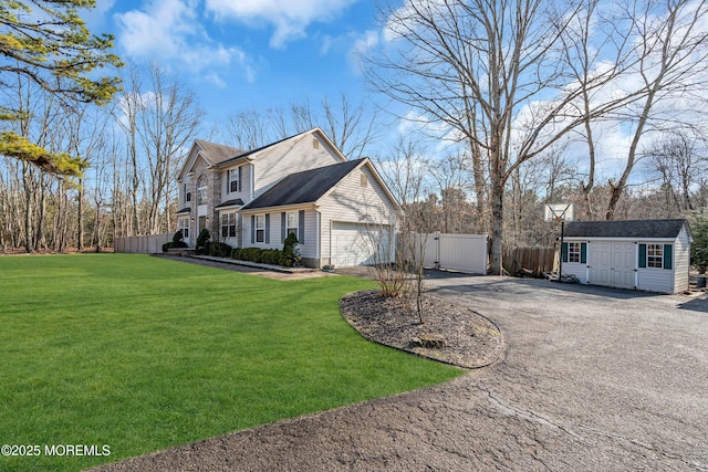 view of property exterior with aphalt driveway, a garage, a storage shed, fence, and a lawn