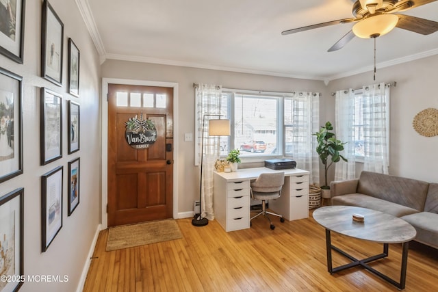 office with light wood-style floors, baseboards, ornamental molding, and ceiling fan