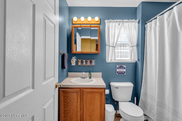 full bathroom with vanity and toilet