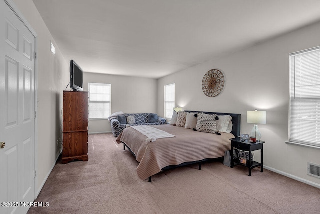 bedroom featuring carpet floors, visible vents, and baseboards