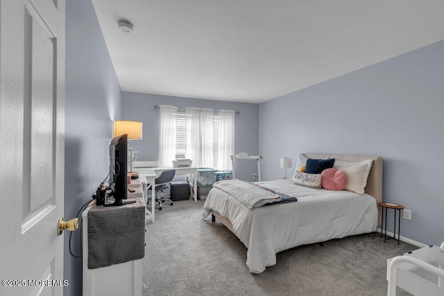 bedroom featuring carpet floors and baseboards