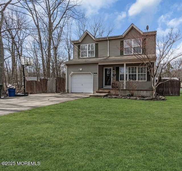 traditional home with driveway, a front lawn, an attached garage, and fence